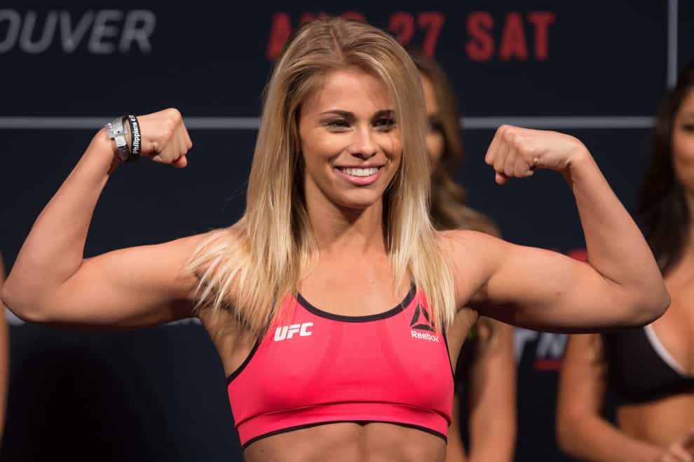 Paige VanZant posing during a UFC fight night (PA Images)