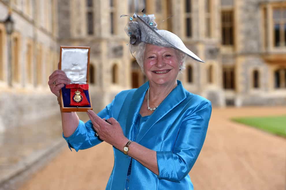 Dame Mary Peters holds her insignia of member of the Order of the Companions of Honour services to sport at Windsor Castle (PA Images)