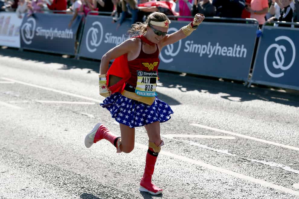 Aly flies over the finish line in world record time (PA Images)
