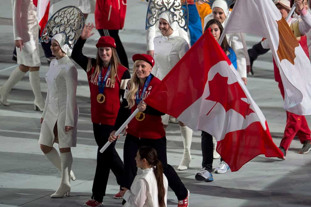 Humphries (right) and Heather Moyes carried the Canadian flag at the Sochi closing ceremony (PA Images)