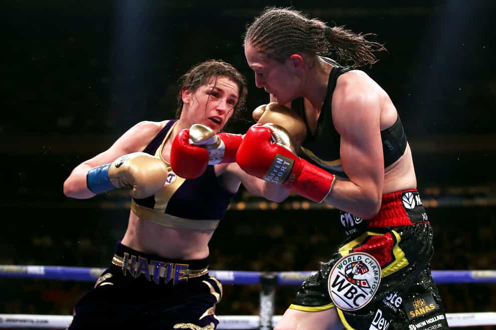 Katie Taylor, left, became undisputed lightweight champion after beating Delfine Persoon (right) in June (PA Images)