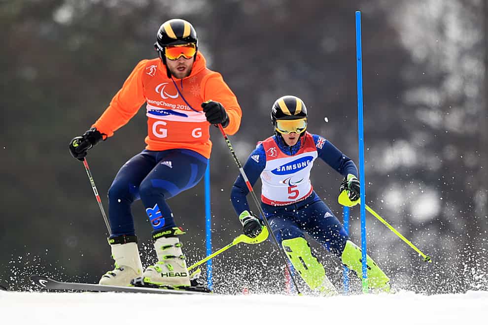 Millie Knight is led by her guide skier Brett Wild (PA Images)