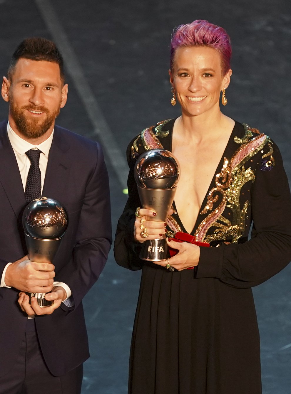 Megan Rapinoe and Lionel Messi claimed Best FIFA player awards as well as their respective ballon d'Or awards in 2019 (PA Images)