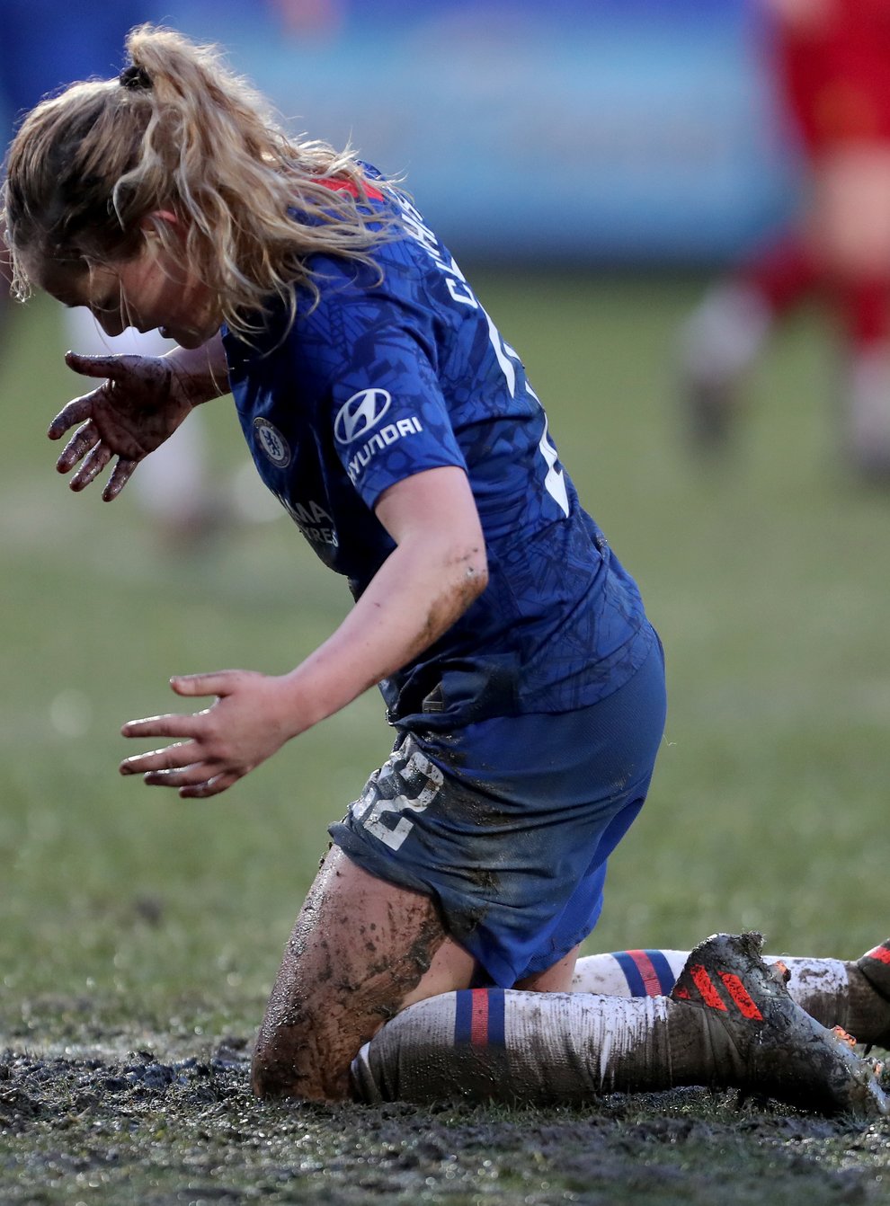 Erin Cuthbert caked in mud during Chelsea's match against Liverpool at Prenton Park (PA Images)