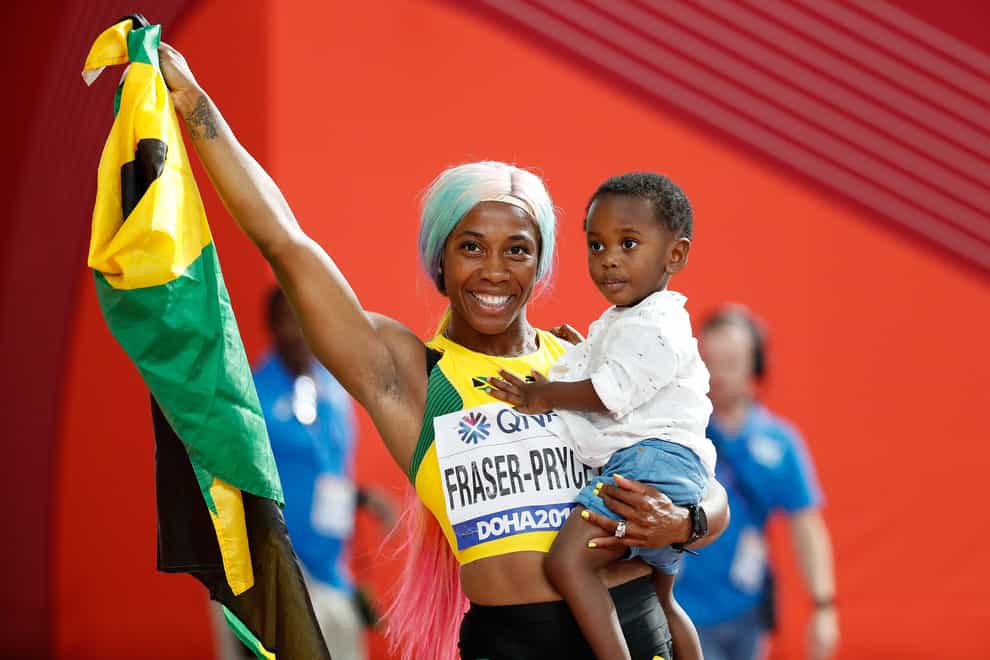 Shelly-Ann Fraser-Pryce with son Zyon at the Doha World Championships (PA Images)