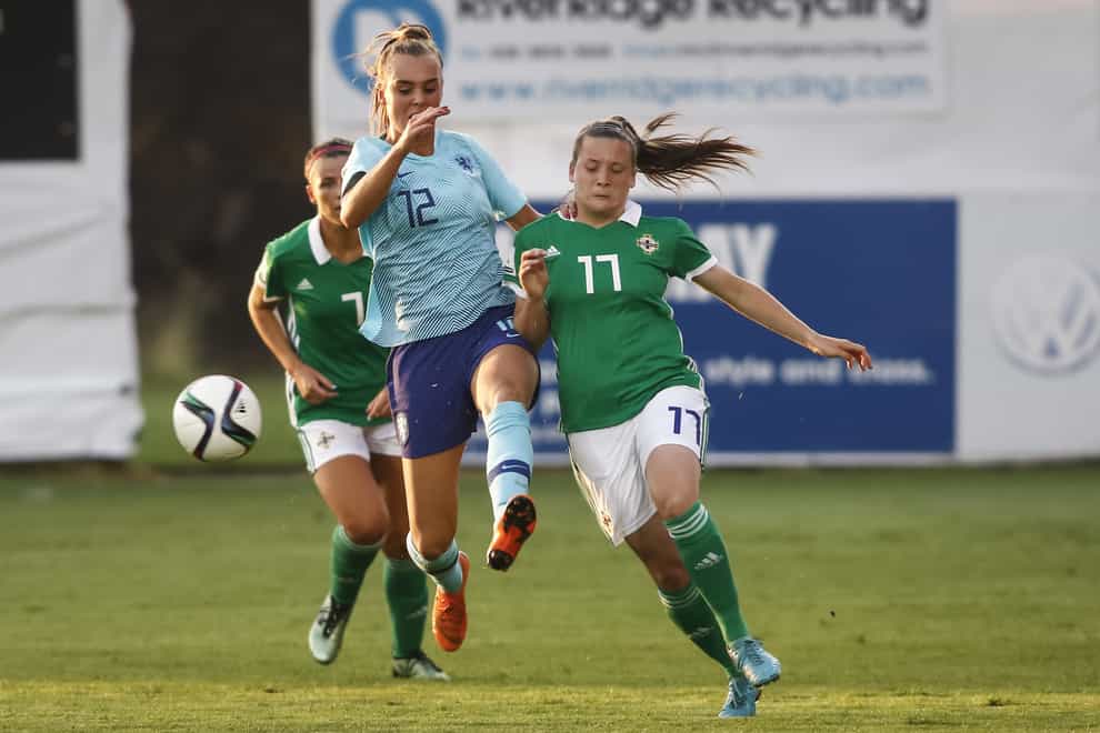 Bell, right, has got six senior caps for Northern Ireland (PA Images)