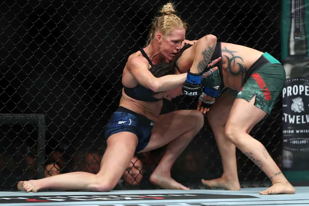 Holm and Pennington spent much of their fight in the clinch (PA Images)