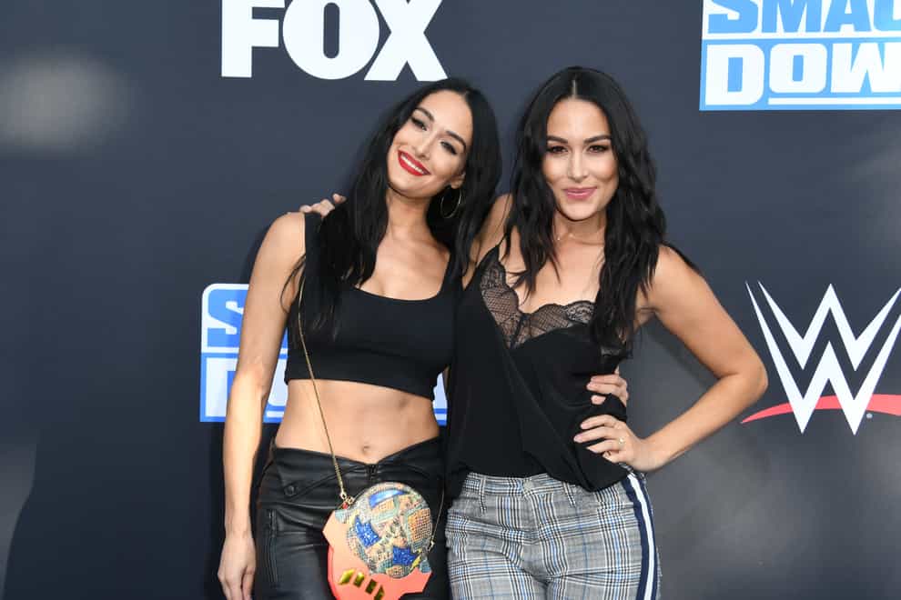 Nikki (left) and Brie Bella (right) are due less than a fortnight apart (PA Images) 
