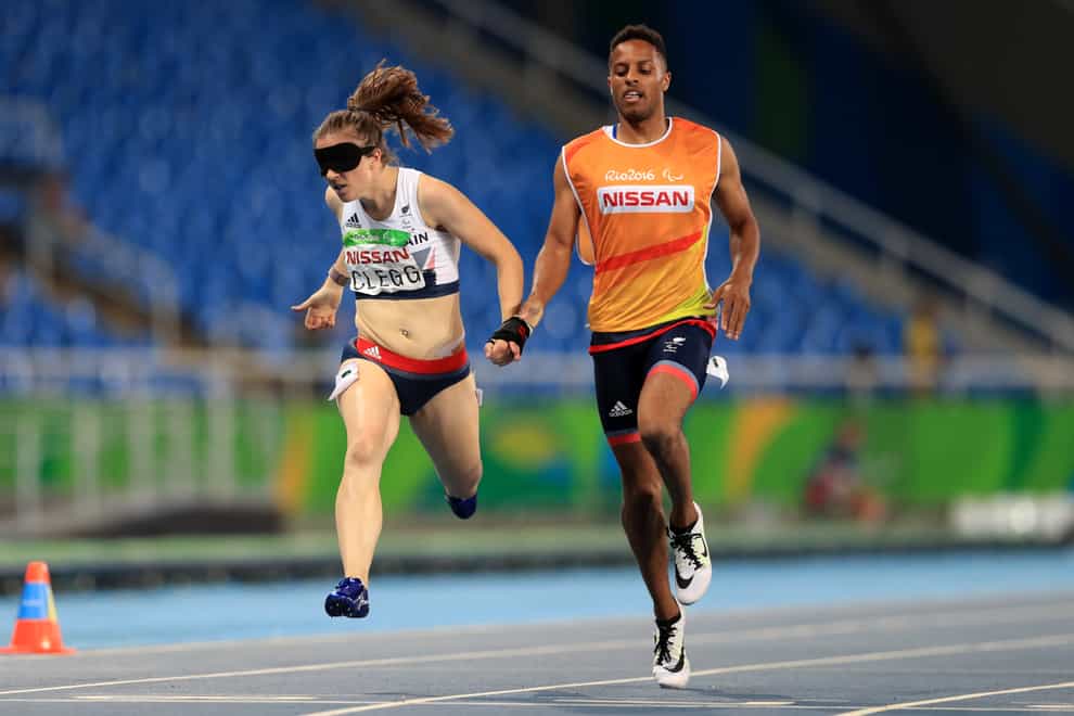 Libby Clegg claims gold in the T11 200m alongside guide Chris Clarke (PA Images)