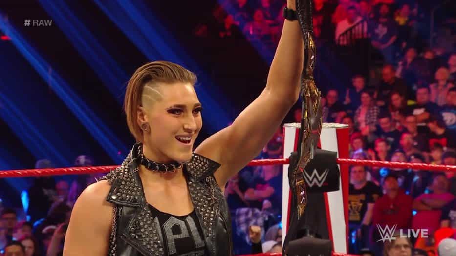 Rhea Ripley holds up her title as she challenges Charlotte Flair (Twitter: @IGRealityEraWWE)