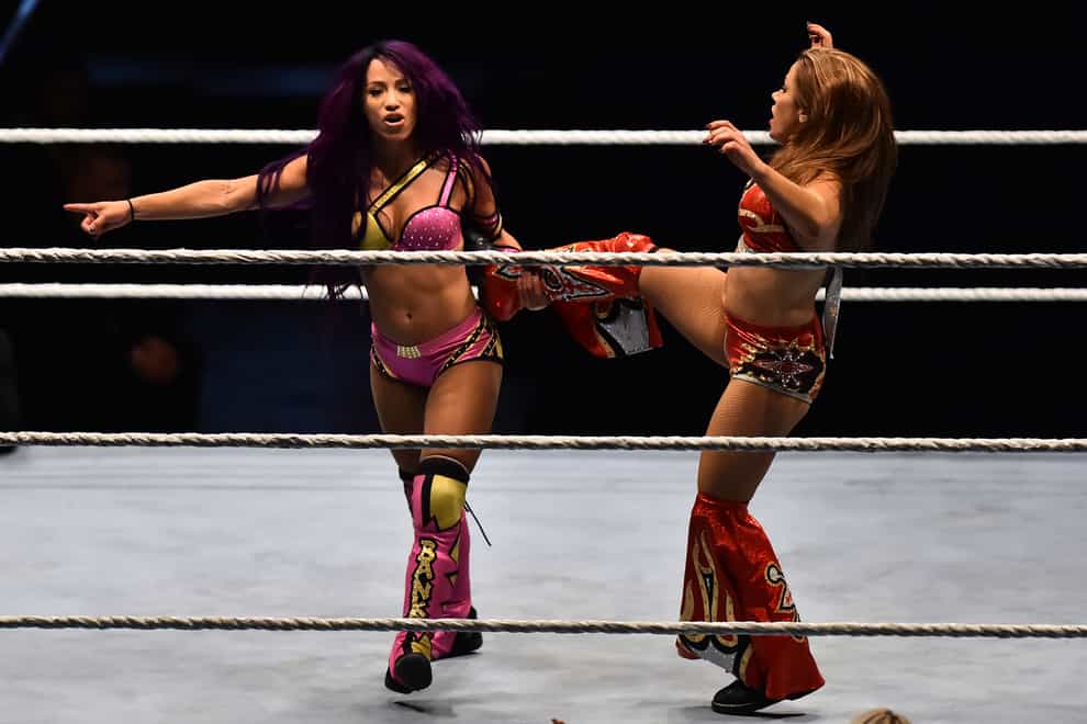 Sasha Banks (left) isn't fussed about the main card (PA Images)