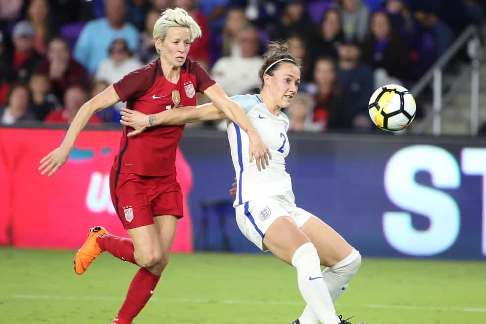 Rapinoe and Bronze battling in the SheBelieves Cup in 2018 (PA Images)
