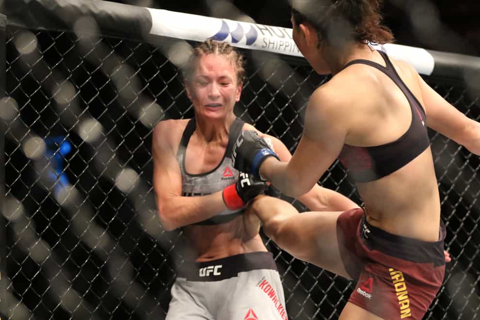 Karolina Kowalkiewicz takes a kick from Yan Xiaonan (PA Images)