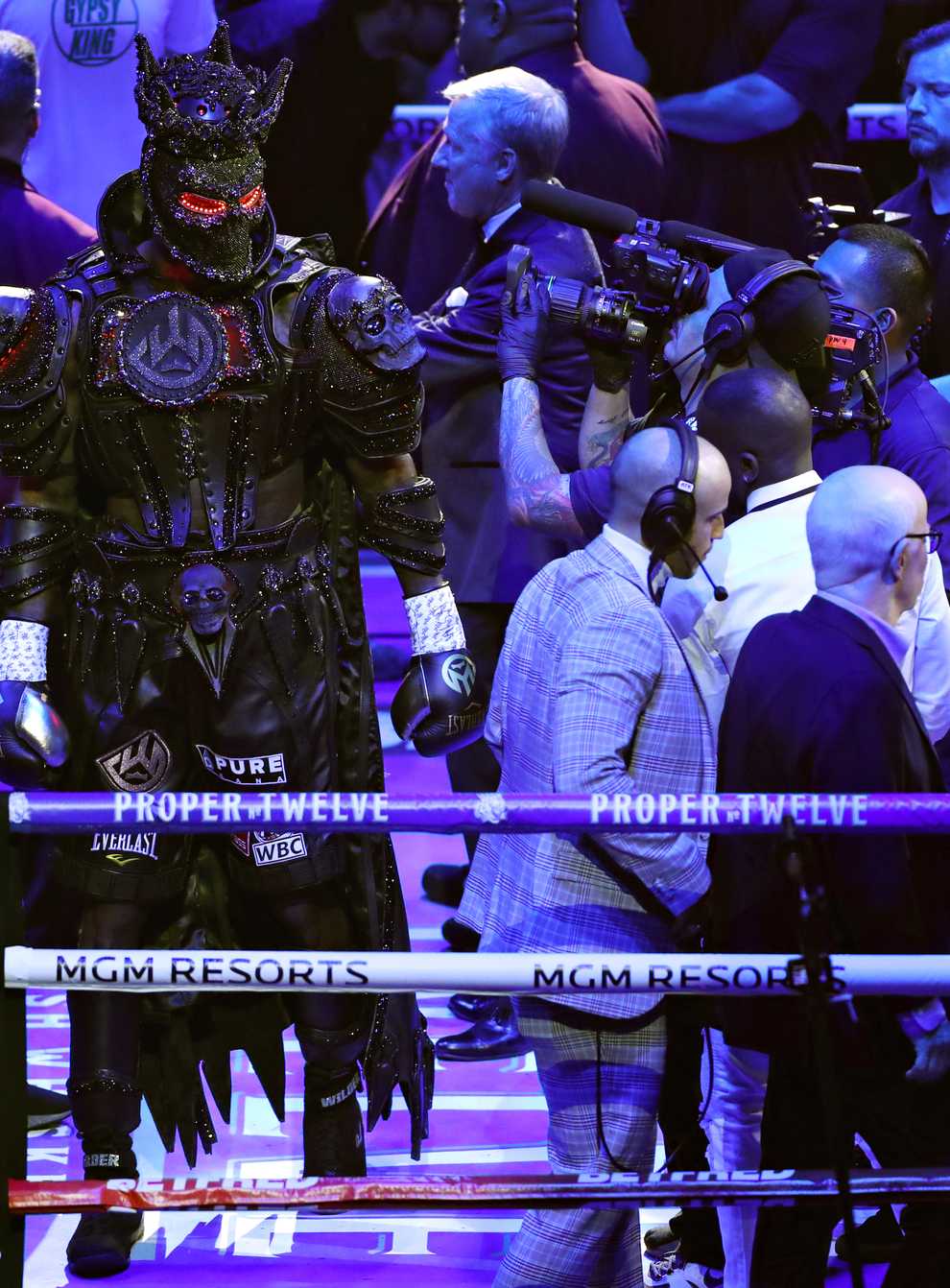 Wilder slowly made his way to the ring draped in his costume and mask (PA Images)