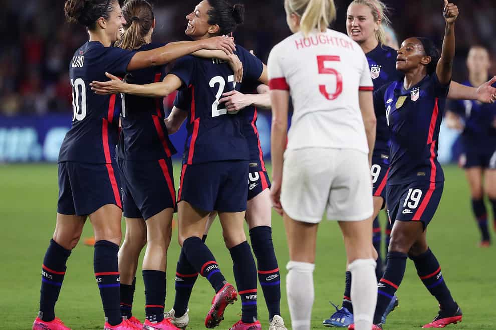 USA celebrate their second goal of the evening as England captain Steph Houghton looks on (PA Images)