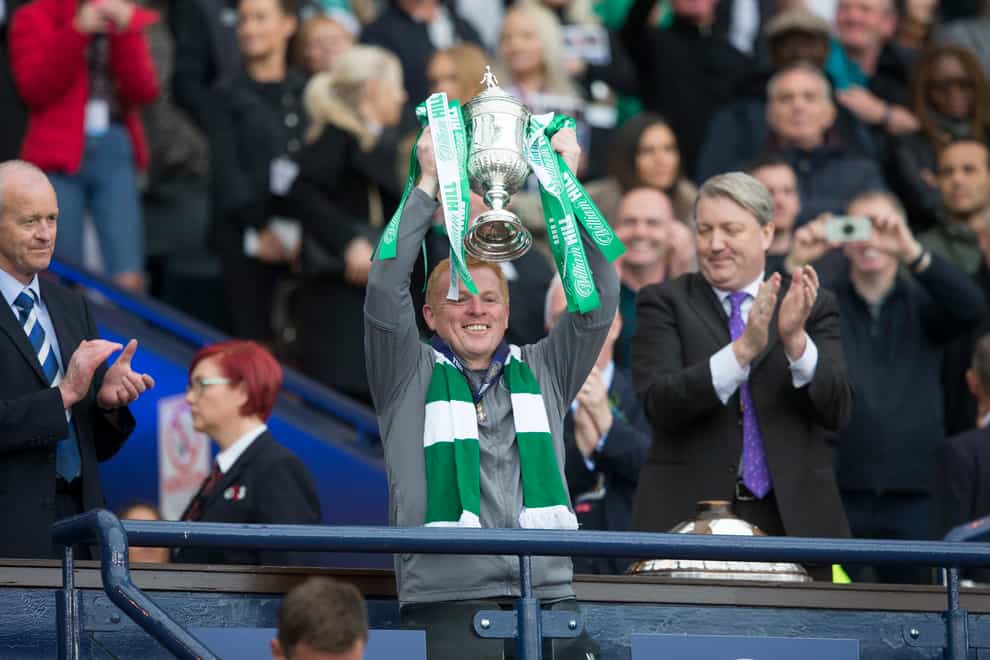 Lennon lifted Celtic's eighth consecutive SPL title last year (PA Images)