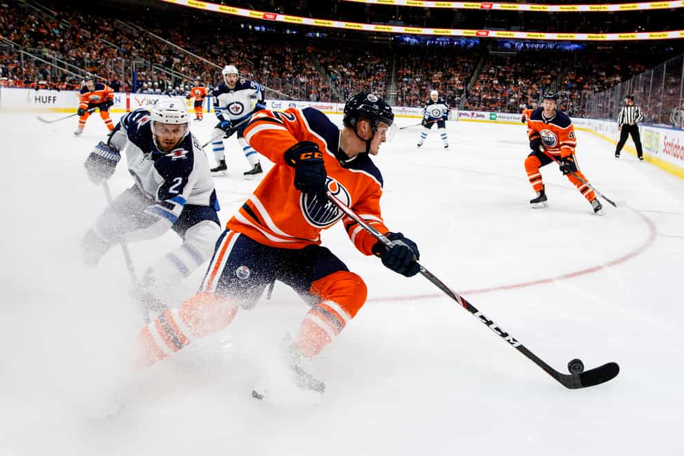 Cave (right) played as a forward for the NHL side, Edmonton Oilers (PA Images)