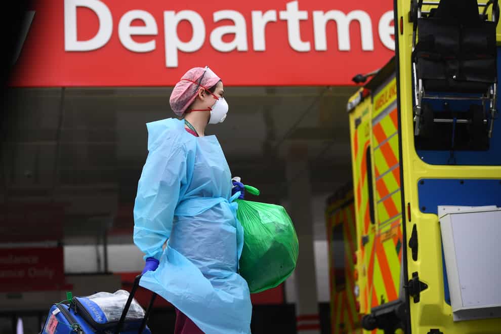An NHS worker wearing full PPE at St Thomas' hospital (PA Images)