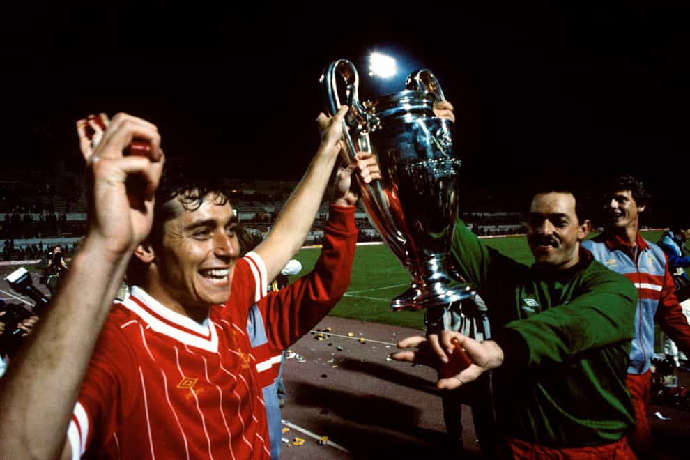 Michael Robinson holds up the 1984 European Cup trophy with goalkeeper Bruce Grobbelaar (PA Images)