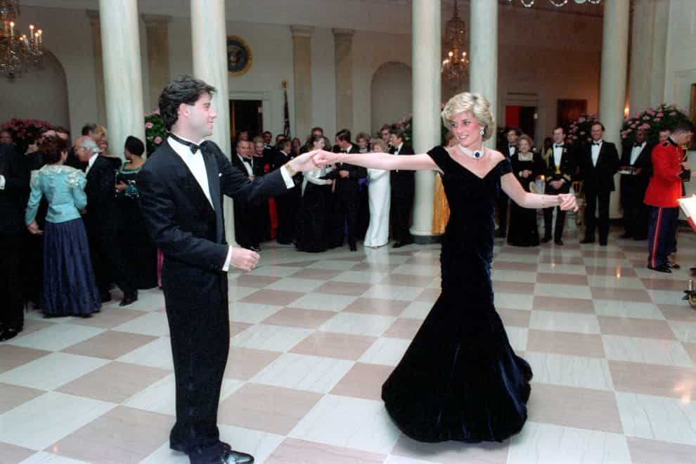 Princess Diana dances with John Travolta at the White House in 1985 (PA Images)