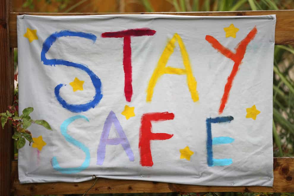 A home made banner saying Stay Safe is hung outside The Dragonfly pub in Basingstoke