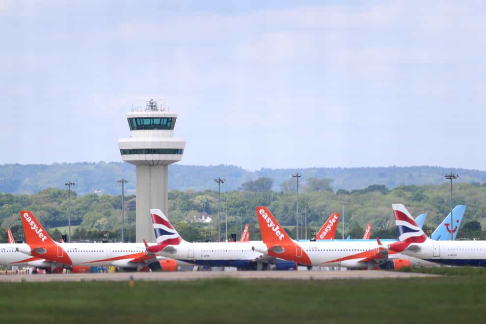 Passenger planes grounded due to the coronavirus outbreak are parked at Gatwick Airport in Sussex