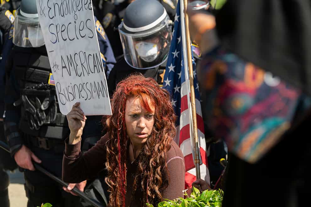 Large crowds of protesters have been seen at Orange County's Huntington beach, San Diego, San Francisco and Sacramento