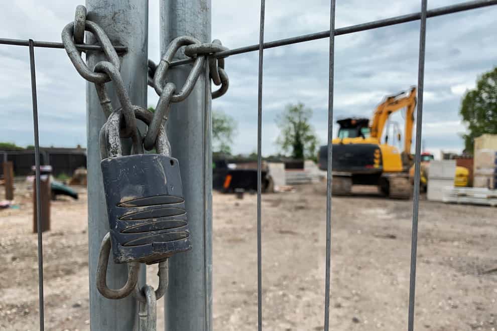 A padlock on the gates of a construction site