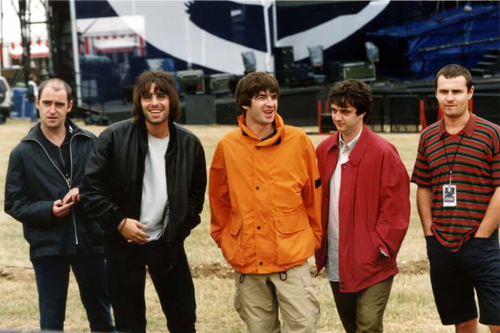 Arthur (left) alongside Liam and Noel before Oasis' famous Knebworth gigs in 1996 (PA Images)