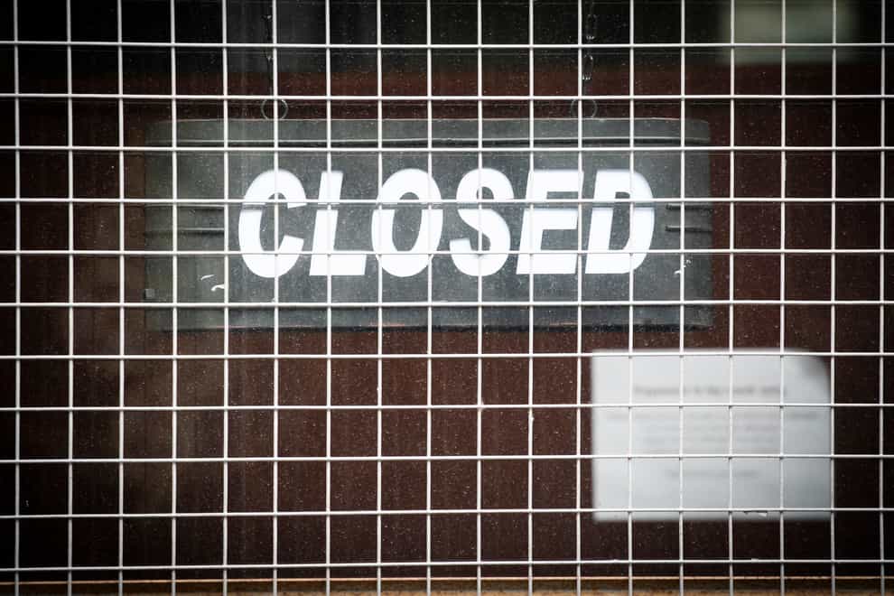 A Closed sign on a business door