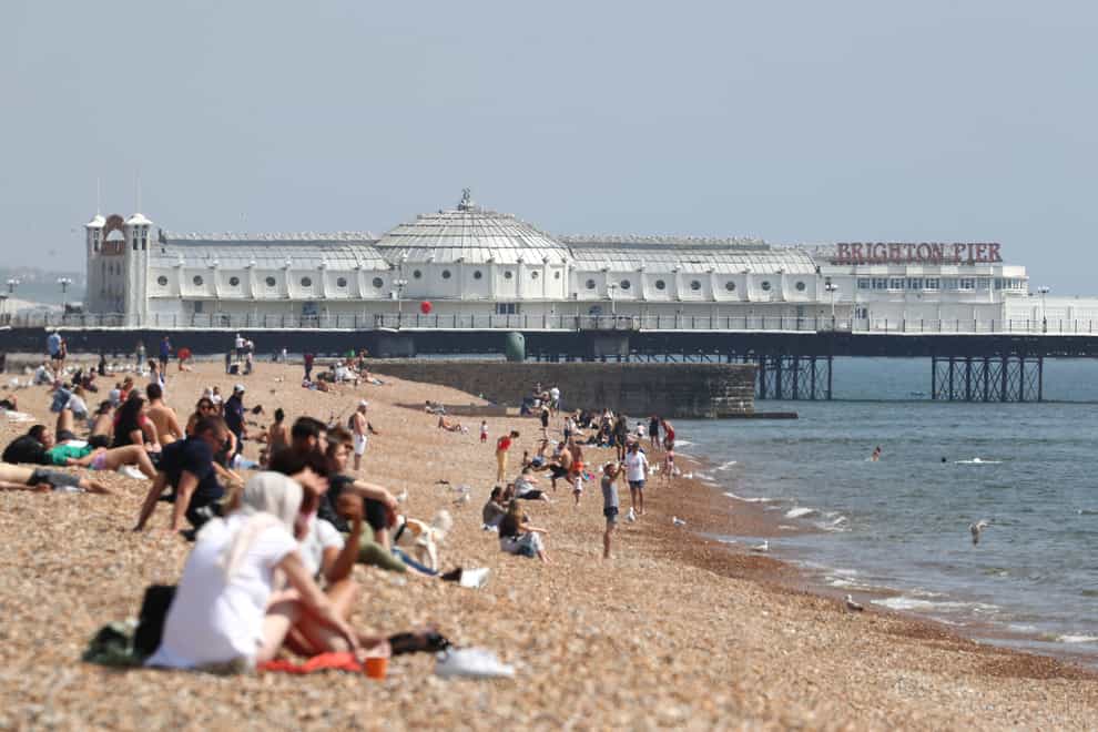 Relaxing on a beach is now permitted in England