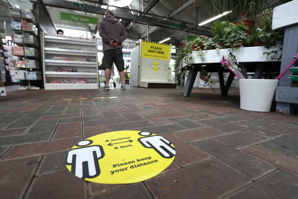 Social distancing signs in place during the reopening of the Capital Gardens’ Sherfield on Loddon Garden Centre near Basingstoke, Hampshire (Andrew Matthews/PA)