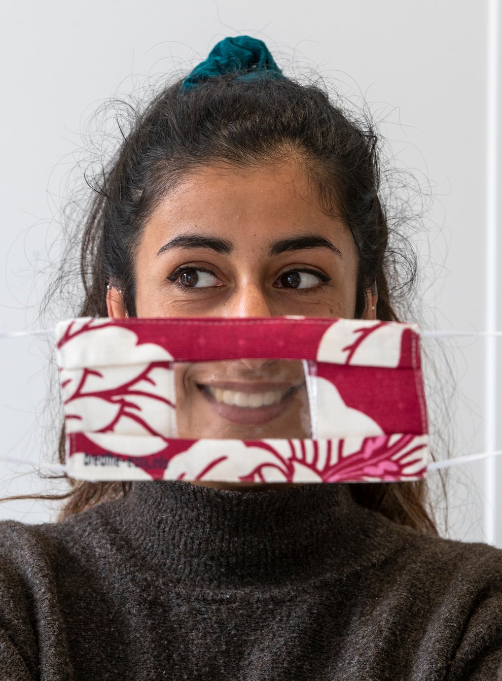 Anjali Punn models a face mask designed for the lip-reading community