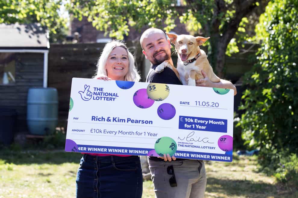 Rich Pearson, 30, and wife Kim, 33, pictured with their rescue dog Loki