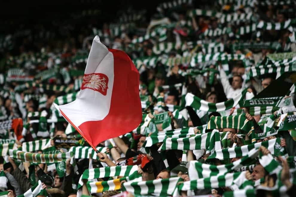 Celtic fans with a Polish flag prior to a football match