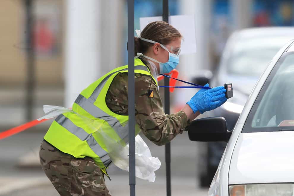 Soldiers from 4th Battalion Yorkshire Regiment help to conduct tests at a drive-through testing centre at Royal Quays shopping outlet in North Shields, North Tyneside (Owen Humphreys/PA)