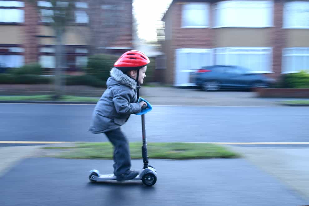 Child on scooter