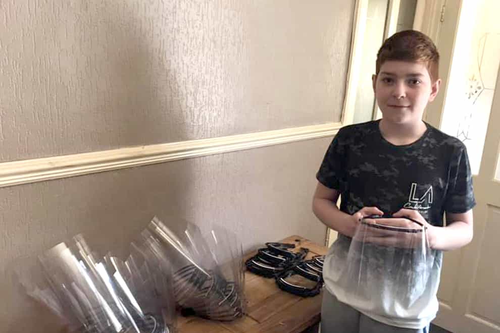 William Stainton, 13, of Scarborough, with some of the PPE he has made for nursing homes across Scarborough and Bridlington