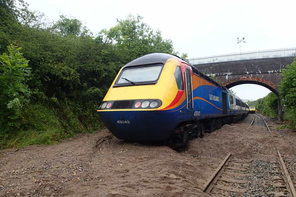 Poor flood management led to a train colliding with debris in an incident which left passengers stranded for more than seven hours, an investigation has found (Rail Accident Investigation Branch/PA)
