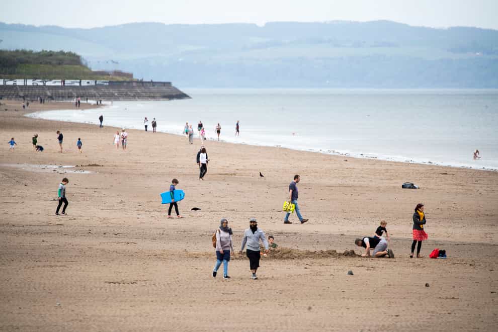 People enjoy the warm weather on Portobello Beach, Edinburgh (Jane Barlow/PA)