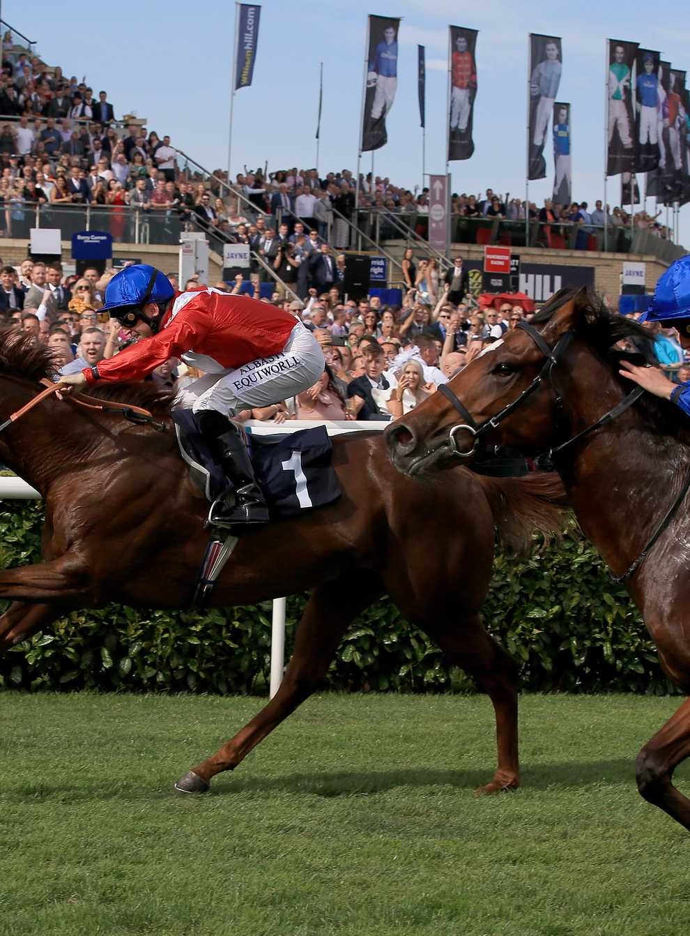 Threat (left) winning the Champagne Stakes at Doncaster