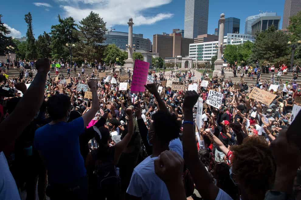 Protesters chant in Civic Center Park Colorado during a protest in response to the police killing of George Floyd