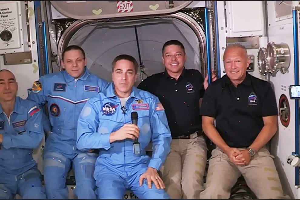 Behnken and Hurley, far right, join the ISS's existing crew