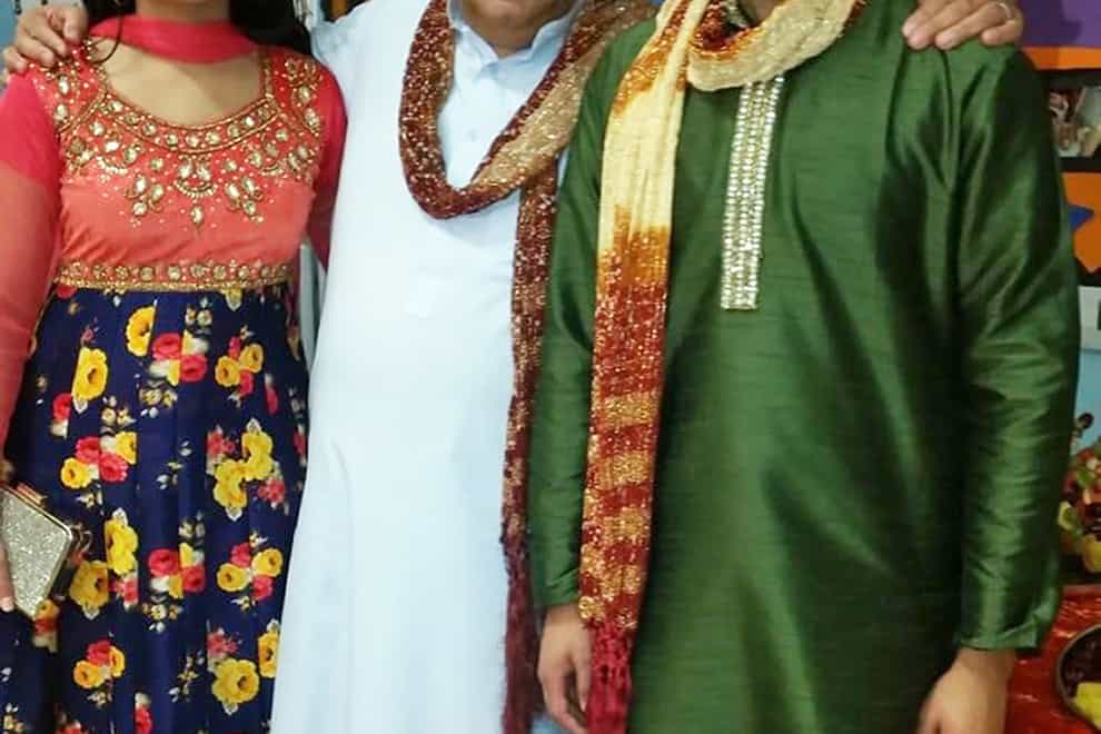 Nassar Hussain (centre) with his daughter Farah and son Adam