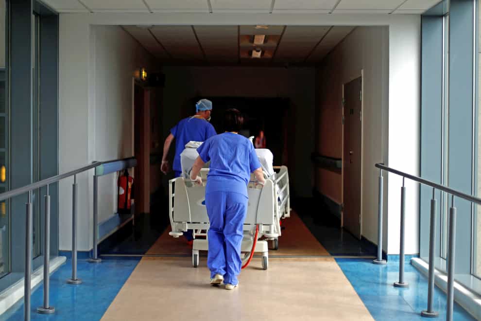 Medical staff transfer a patient through a corridor at The Royal Blackburn Teaching Hospital in East Lancashire