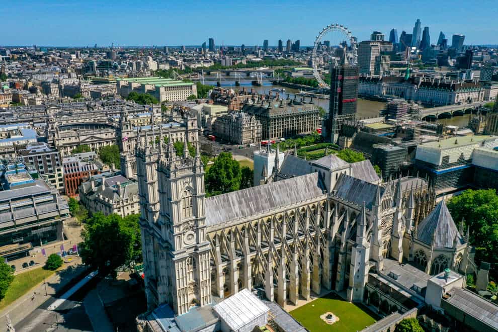 An aerial view of London showing Westminster Abbey, the London Eye, County Hall, Westminster Bridge, Hungerford Bridge, Waterloo Bridge and Parliament Street
