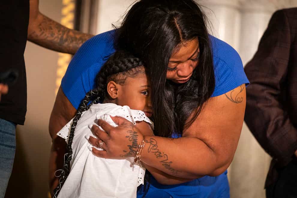 Roxie Washington hugs her daughter Gianna at her first press conference following the death of George Floyd