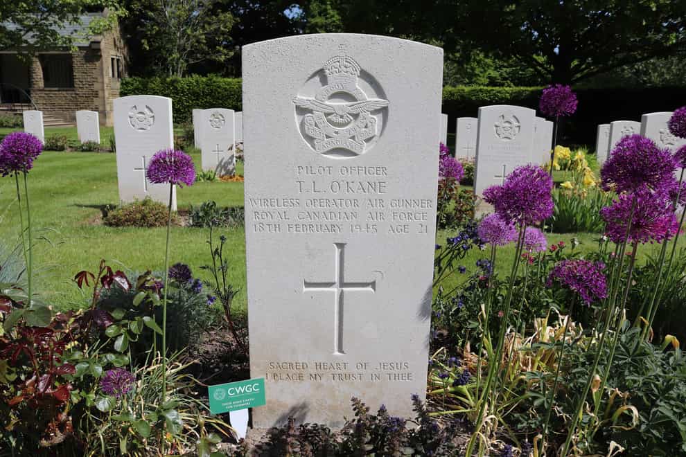 A Commonwealth War Graves Commission tribute marker in place on a grave