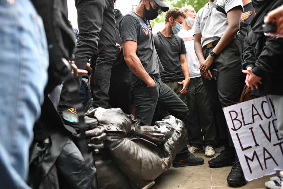 Protesters pull down a statue of Edward Colston during a Black Lives Matter protest rally