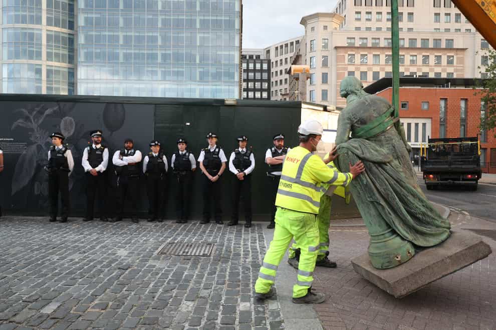 A statue of slave owner Robert Milligan is removed from West India Quay in east London